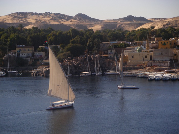 Feluccas sailing on the Nile seen from our hotel room window in Aswan.