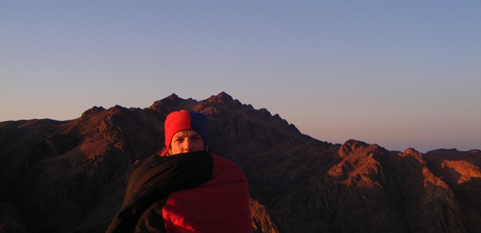 Me, cold and tired, on the summit of Mount Sinai watching the sun rise.