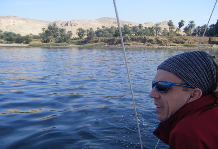 Me looking out from the felucca as we gently sailed down the Nile. There was a small amount of green life on either bank but then the desert resumed. It was pretty chilly until after midday!