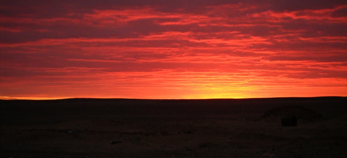 Sunset and rubbish in the desert at the services on the road from Bahariya Oasis back to Cairo.