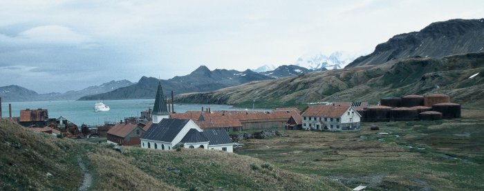 Grytviken whaling station on South Georgia. A cruise ship is anchored in Cumberland Bay.