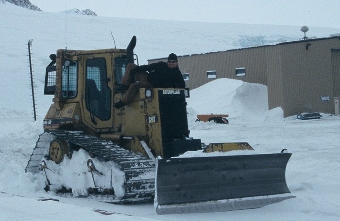 Chrissy J with his favourite bull-dozer after clearing snow for the South Pole evacuation flight.