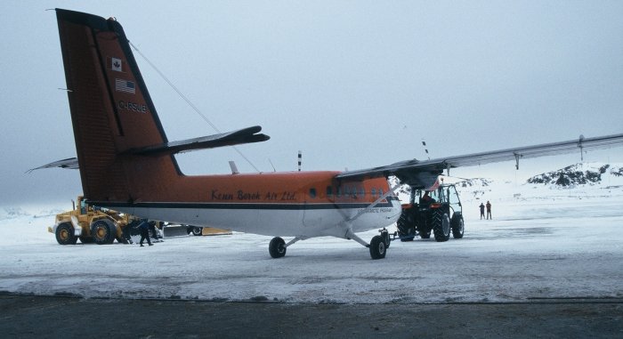 The Canadian Twin Otter being backed into the hangar after landing for the South Pole flight.