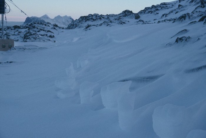 Raised foot prints left in the snow after a storm.