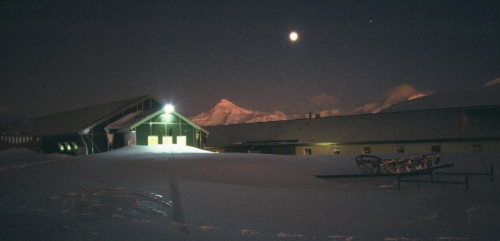 Fuchs House (the field store) and Admirals House (the main accomodation building) during the permanent darkness of winter.