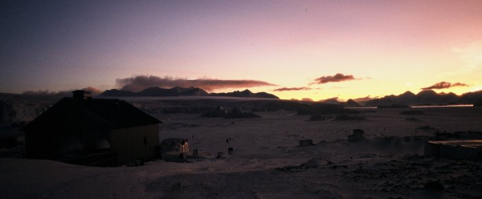 The sewage treatment plant, sea ice and small bergs in Hangar Bay over winter.
