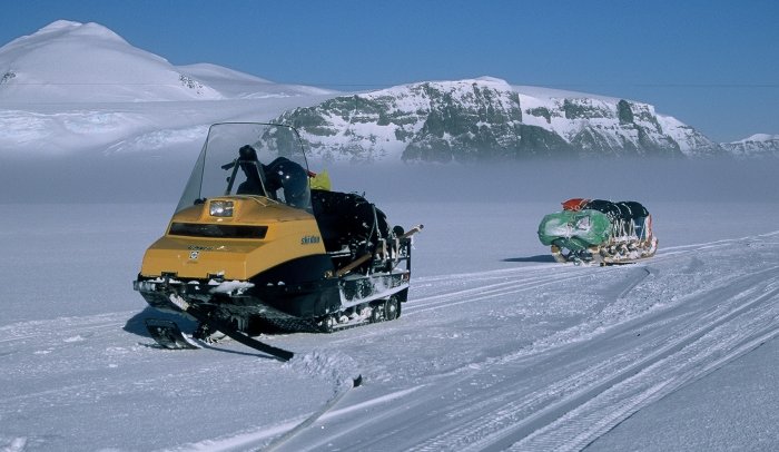 My skidoo and sledge on the Fuchs Ice Piedmont after climbing up out of the mist covering Carvajal.