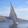 Another felucca without guests on returning downwind, but upstream to Aswan. We were moored to the eastern bank eating lunch at the time.