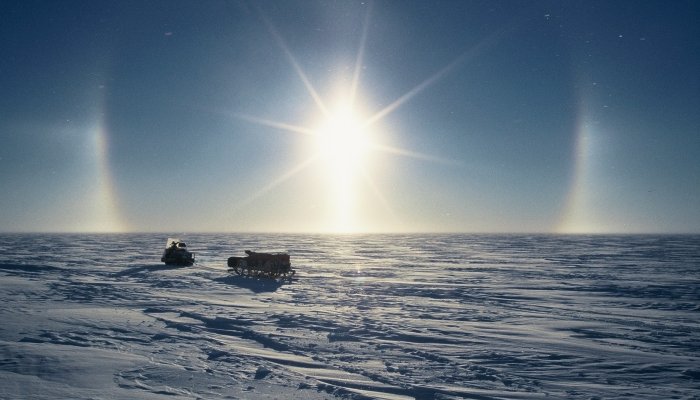 A halo around the sun. My skidoo and sledge are being used during a training session before my first winter trip.